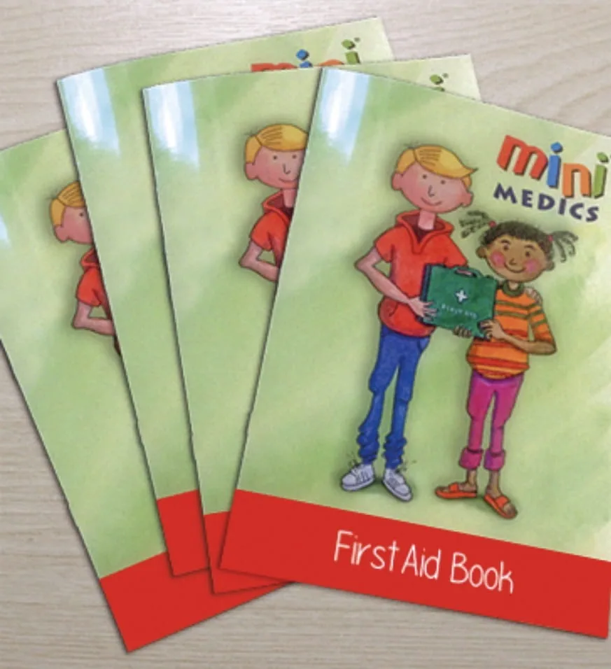 Four Mini Medics First Aid Book booklets fanned out on a table